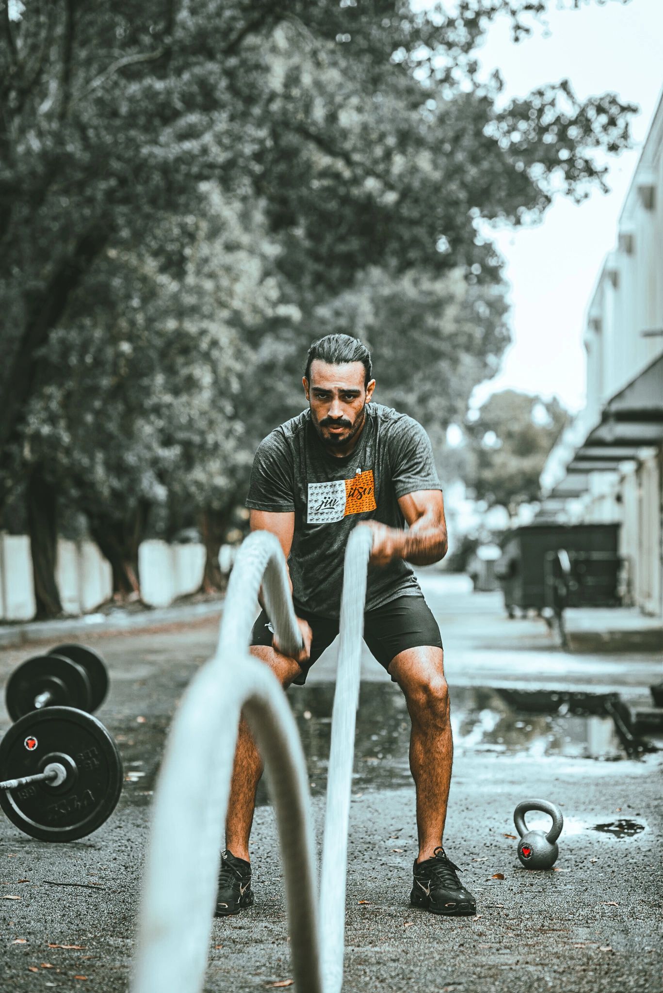Athlete training with battle ropes